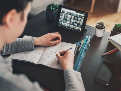 Man doing math equations while on a video call
